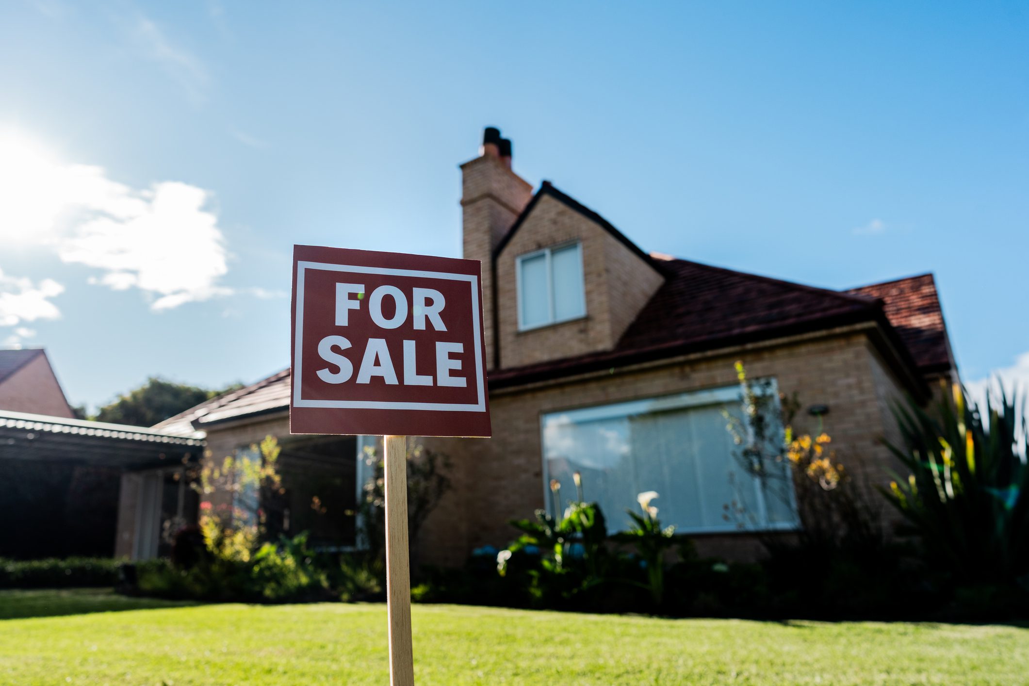 House for sale sign at yard